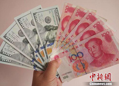人民币和美元资料图。<a target='_blank' href='http://www.chinanews.com/' >中新网</a>记者 李金磊 摄

